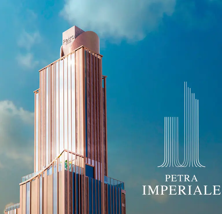 Rendering ufficiale di Petra Imperiale: la torre residenziale di Grupo Petra contro il cielo di Asunción, con il logo del progetto